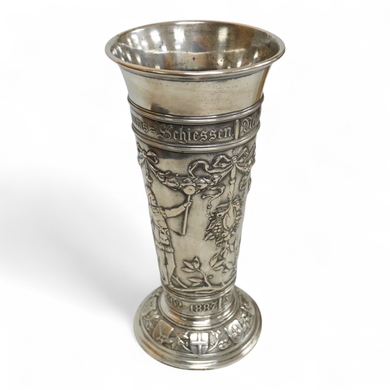 A late 19th century German 800 standard white metal 25th anniversary commemorative vase, embossed with figures, swags and ribbons, 20.9cm, 7.6oz.